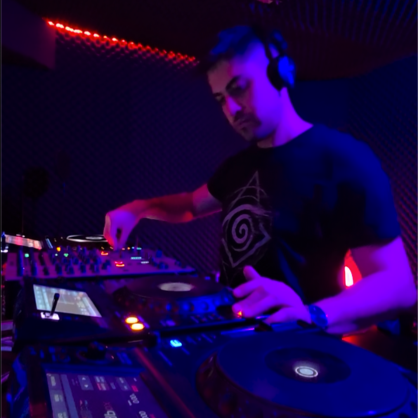 Black and white photo of Andres Katalan DJing